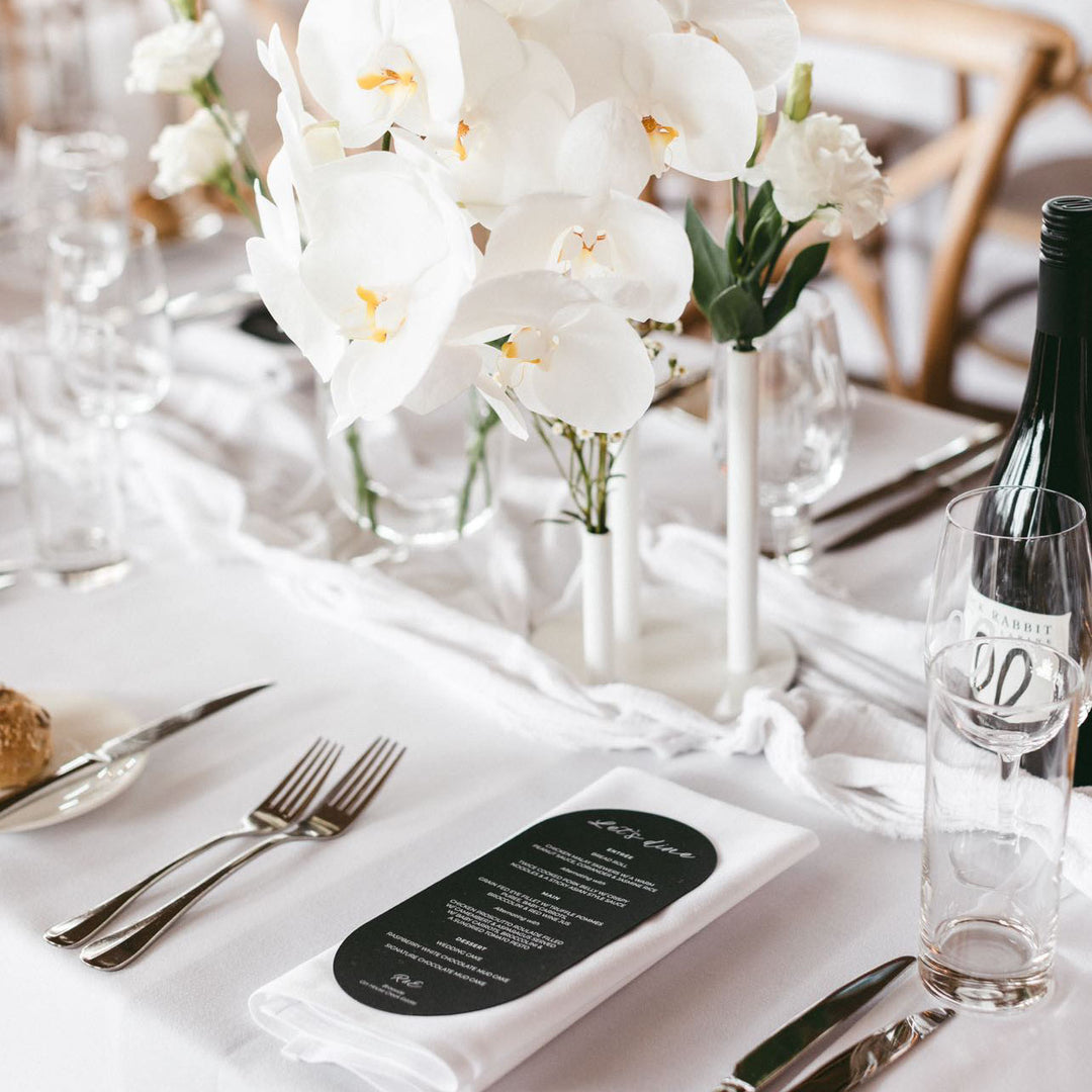Modern wedding menu printed with white ink onto a black card-stock.