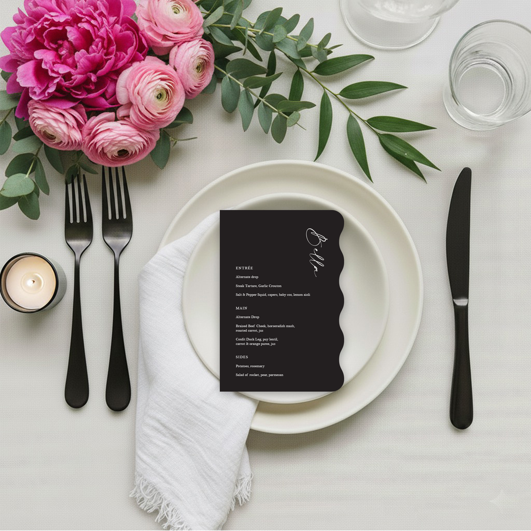Wedding menu in a black and white colour palette in a long edge wave shape