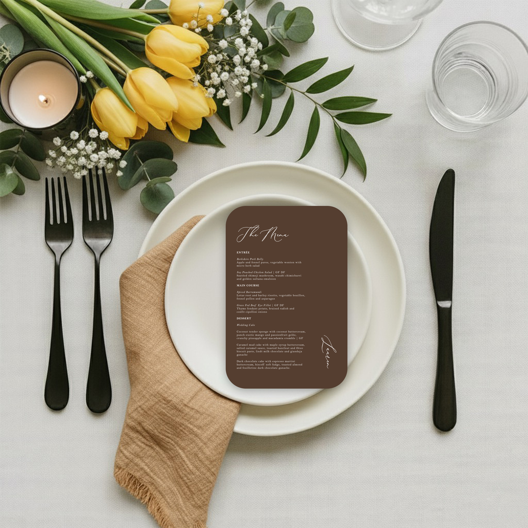 Wedding menu card and place card combination on a table setting in a chocolate brown