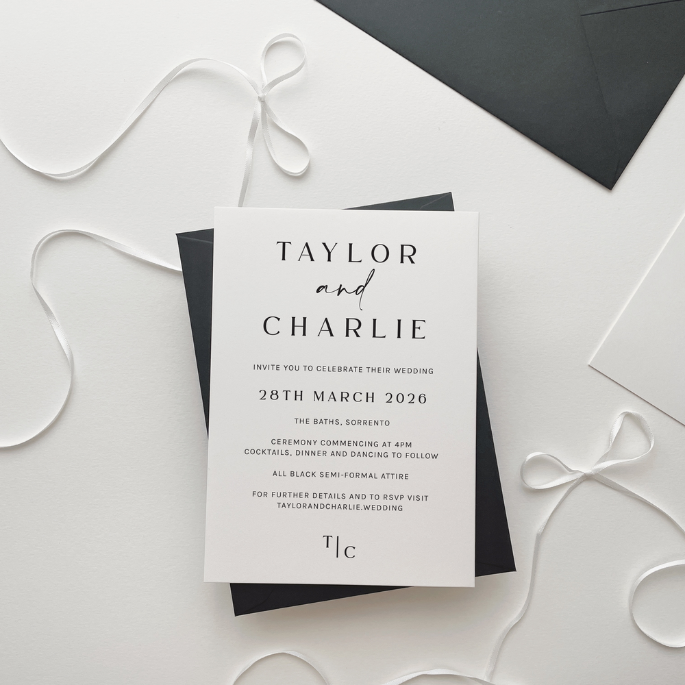 Taylor wedding invitation suite by Ivory & Ink Weddings — bold and clean with a confident edge, strong capital lettering and soft script touch between names.
